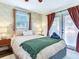 The main bedroom features access to the outdoor patio and pool area, enhancing indoor-outdoor living at 1243 55Th N Ave, St Petersburg, FL 33703