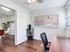 Functional home office with a ceiling fan, a rolling chair and a large window that provides natural light at 1243 55Th N Ave, St Petersburg, FL 33703