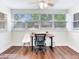 Bright home office with large windows offering natural light, complete with a modern desk and comfortable seating at 1243 55Th N Ave, St Petersburg, FL 33703