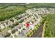Overhead shot displays a home near a pond in a residential neighborhood at 12624 White Bluff Rd, Hudson, FL 34669