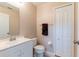 Clean bathroom with white vanity and convenient storage at 12624 White Bluff Rd, Hudson, FL 34669