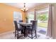 Dining area with sliding glass doors leading to outdoor patio at 12624 White Bluff Rd, Hudson, FL 34669
