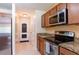 Well-lit kitchen with stainless appliances and backyard access at 12624 White Bluff Rd, Hudson, FL 34669