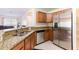Well-equipped kitchen with granite counters and stainless appliances at 12624 White Bluff Rd, Hudson, FL 34669