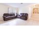 Bright living room with tile floors and comfortable seating at 12624 White Bluff Rd, Hudson, FL 34669