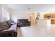 Open concept living room and kitchen features tile flooring at 12624 White Bluff Rd, Hudson, FL 34669