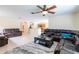Open-concept layout with comfortable living room furniture with a view to the kitchen at 12624 White Bluff Rd, Hudson, FL 34669