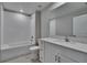 Bathroom boasts a shower with white subway tiles, quartz counters, and modern vanity at 13187 Palmerston Rd, Riverview, FL 33579