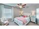 Bright bedroom features ceiling fan, and a window with blinds at 13187 Palmerston Rd, Riverview, FL 33579