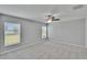Bright bedroom features a ceiling fan and carpet flooring at 13187 Palmerston Rd, Riverview, FL 33579