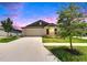 Charming single-story home featuring a manicured lawn, neutral-colored siding, and a two-car garage at 13187 Palmerston Rd, Riverview, FL 33579