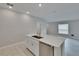 Stylish kitchen island boasts quartz countertops, stainless steel appliances, and seamless access to dining at 13187 Palmerston Rd, Riverview, FL 33579