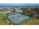 Aerial view of community tennis courts surrounded by lush landscaping and neighborhood at 13187 Palmerston Rd, Riverview, FL 33579