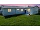 Picture of the backyard with neatly trimmed grass and a small potted plant, setting a serene and inviting outdoor space at 1415 Yale Dr, Holiday, FL 34691