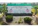 Community sports complex sign with landscaping and American flags at 1510 Flamingo Ln, Sun City Center, FL 33573
