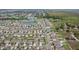 Aerial view of the community highlights the organized layout and proximity to natural water features at 15403 Wicked Strong St, Sun City Center, FL 33573