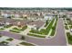 Aerial view of a well-kept home with manicured lawn in a planned community at 15403 Wicked Strong St, Sun City Center, FL 33573
