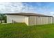 Side view of a well-manicured fenced backyard at 15403 Wicked Strong St, Sun City Center, FL 33573