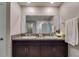 Bathroom vanity with double sinks and granite counters provide ample space in this bright bathroom at 15403 Wicked Strong St, Sun City Center, FL 33573