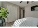 Cozy bedroom showcases natural light, closet space, and a minimalist design, providing comfort and functionality at 15403 Wicked Strong St, Sun City Center, FL 33573