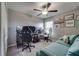 This bedroom features a desk with multiple monitors and a comfortable seating area at 15403 Wicked Strong St, Sun City Center, FL 33573