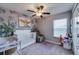 Charming Bedroom with a white crib, soft rug, and playful décor, creating a cheerful and comforting space at 15403 Wicked Strong St, Sun City Center, FL 33573