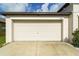 Closed garage door, showcasing the front exterior of the home at 15403 Wicked Strong St, Sun City Center, FL 33573
