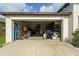 Spacious two-car garage filled with household items and tools at 15403 Wicked Strong St, Sun City Center, FL 33573