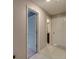 Hallway view showing access to rooms and tile flooring at 15403 Wicked Strong St, Sun City Center, FL 33573