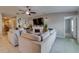 Inviting living room featuring a fireplace, comfortable seating, and bright, neutral color palette at 15403 Wicked Strong St, Sun City Center, FL 33573