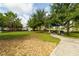 Community park with green space, shade trees, seating, and walking paths at 15403 Wicked Strong St, Sun City Center, FL 33573