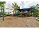 Community playground with shade, swings, and play equipment at 15403 Wicked Strong St, Sun City Center, FL 33573