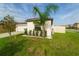 View of the side yard featuring manicured landscaping and a privacy fence at 15403 Wicked Strong St, Sun City Center, FL 33573
