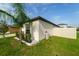 Exterior shot showcasing the well-kept side yard and a portion of the home's facade at 15403 Wicked Strong St, Sun City Center, FL 33573