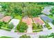 Inviting single-Gathering home featuring a refreshing backyard pool and lush green landscaping at 1610 Stetson Dr, Wesley Chapel, FL 33543