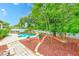 Lush backyard features a sparkling pool, perfect for outdoor relaxation and enjoyment at 1610 Stetson Dr, Wesley Chapel, FL 33543
