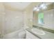 Bright bathroom featuring a tub with shower, toilet and a single sink vanity at 1610 Stetson Dr, Wesley Chapel, FL 33543
