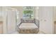 Bathroom with a soaking tub, a glass shower, and decorative tile surround at 1610 Stetson Dr, Wesley Chapel, FL 33543