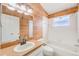 Bathroom featuring a single sink vanity and tub with shower at 1610 Stetson Dr, Wesley Chapel, FL 33543