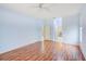 Bedroom with wood floors and access to multiple bathrooms via connecting doors at 1610 Stetson Dr, Wesley Chapel, FL 33543