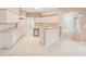Spacious kitchen with white cabinets, tiled floors, and modern appliances at 1610 Stetson Dr, Wesley Chapel, FL 33543