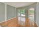 Spacious living room with hardwood flooring and sliding glass doors to the outdoor patio at 1610 Stetson Dr, Wesley Chapel, FL 33543