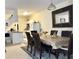 Inviting dining area adjacent to the kitchen, featuring a sophisticated table and elegant decor at 16511 Enclave Village Dr # 107, Tampa, FL 33647