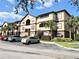 Attractive three story condo building featuring neutral exterior and well maintained landscaping at 16511 Enclave Village Dr # 107, Tampa, FL 33647