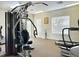 Community gym with modern exercise equipment, including weight machines and treadmills at 16511 Enclave Village Dr # 107, Tampa, FL 33647