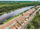 Stunning aerial view of a waterfront community with lush landscaping and serene canal access at 1710 Lago Vista Blvd, Palm Harbor, FL 34685