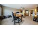 This large bedroom is well-lit with neutral colored walls and tile floor at 1710 Lago Vista Blvd, Palm Harbor, FL 34685