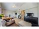 This bedroom features a high ceiling, a television, and access to a closet at 1710 Lago Vista Blvd, Palm Harbor, FL 34685