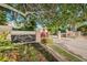 Eagles Reserve entrance featuring manicured landscaping and secure gated access at 1710 Lago Vista Blvd, Palm Harbor, FL 34685