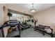 Spacious exercise room with mirrored wall and an array of fitness equipment for a complete workout experience at home at 1710 Lago Vista Blvd, Palm Harbor, FL 34685